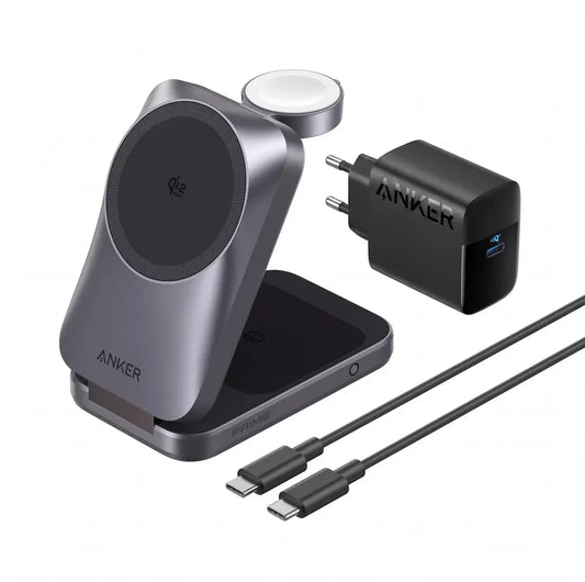 An Anker wireless charging setup on a white background, featuring a gray magnetic wireless charging dock with a circular charging pad, a black USB-C wall charger labeled ANKER, and two black USB-C cables. 45 W. Apple compatible. Qi2.