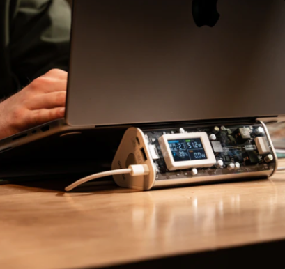 SHARGE Shargeek 170 power bank with transparent design charging a laptop, showcasing smart features and great capacity.